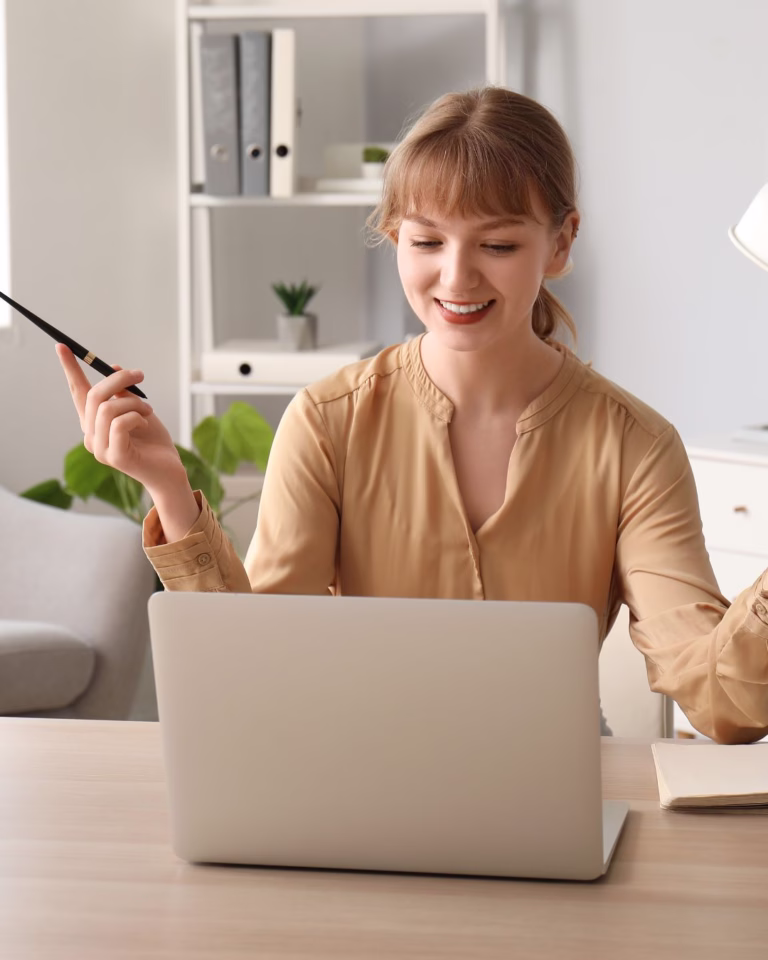 how to land a remote job; woman on a laptop talking